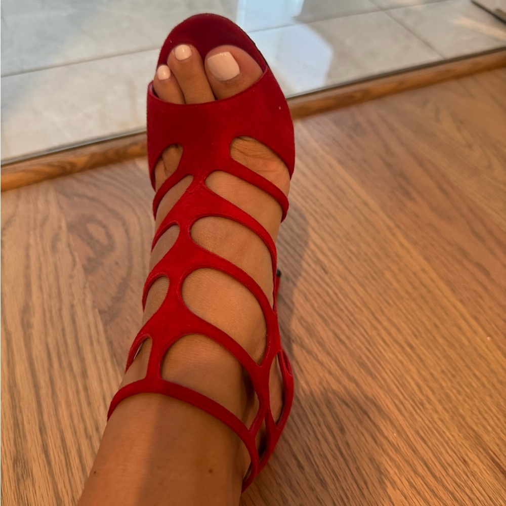 Red velvet Jimmy Choo heels.